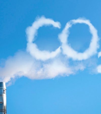 Smoke of chimney writing CO2 in the sky